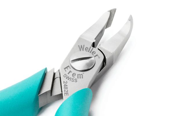 The image shows a pair of pliers with a silver metal head and ergonomic, turquoise handles. The head has two sharp jaws for gripping and cutting.