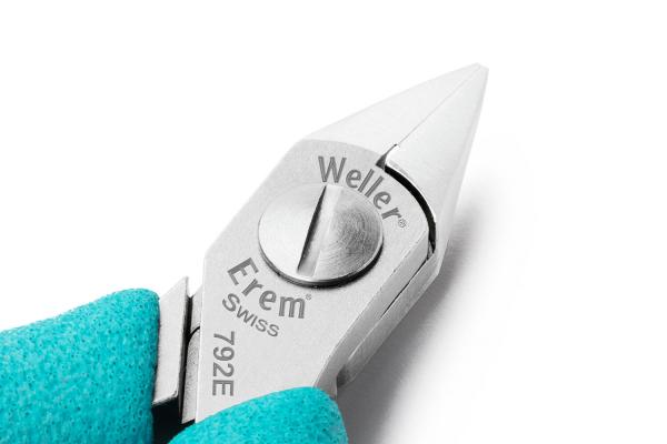 The image shows a pointed pair of pliers with a smooth, shiny metal head and a rotating control in the middle. The handle is light blue and ergonomically shaped.
