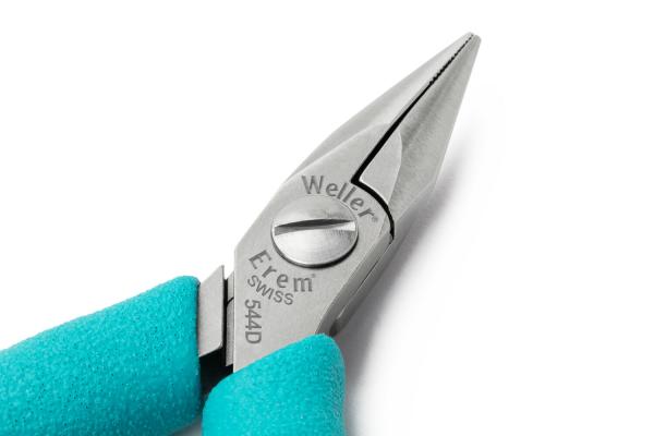 The image shows a small, pointed pair of pliers with a silver metal handle and turquoise, rubberized grips. The pliers have a pointed shape and a logo on the side.