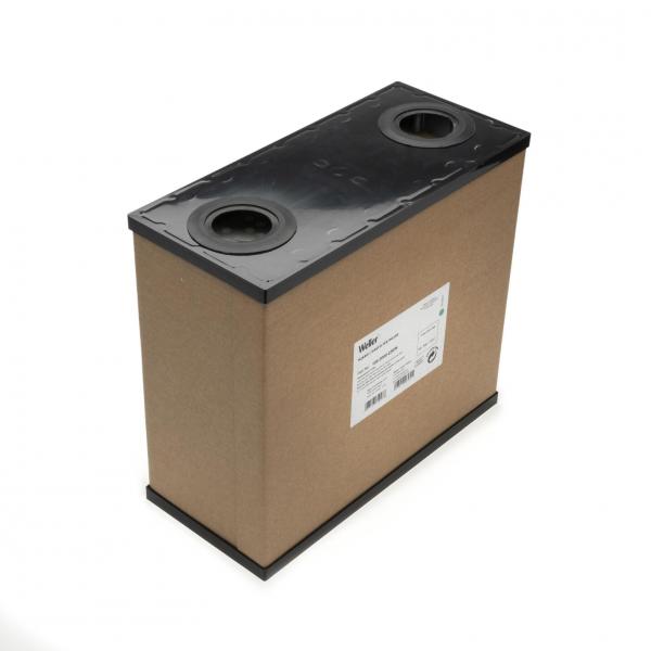 The image shows a rectangular, brown box with a black lid. There are two round openings on top and a label with information on the side. The box appears sturdy and functional.