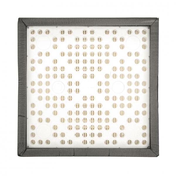 The image displays a square area with many small, round openings in a uniform pattern. The frame is dark and accentuates the white surface.