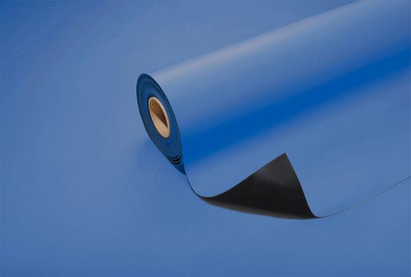 The image shows a roll of blue paper that is partially unrolled. The surface is smooth and glossy. There is a black area visible at the bottom, while the rest is blue.