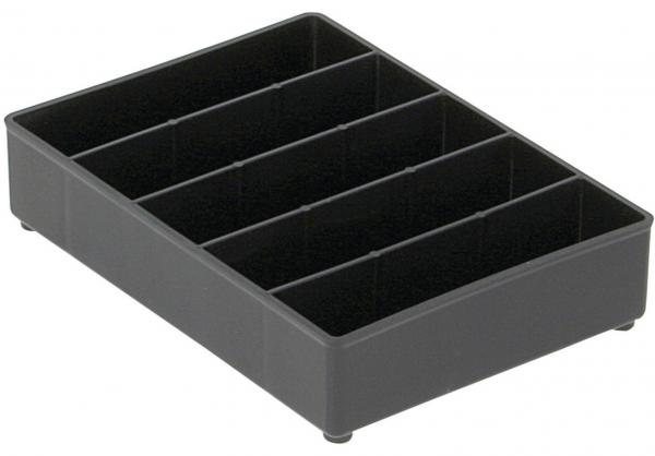 Das Bild zeigt eine dunkle, rechteckige Box mit sechs senkrechten Fächern. Die Fächer sind gleichmäßig verteilt und dienen zur Aufbewahrung von Utensilien oder Kleinartikeln.