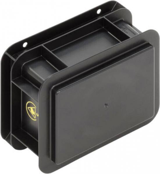 Das Bild zeigt eine schwarze, rechteckige Box mit leicht abgerundeten Kanten und einem flachen Deckel. An der Rückseite sind zwei Löcher zur Befestigung. Sie wirkt robust und funktional.