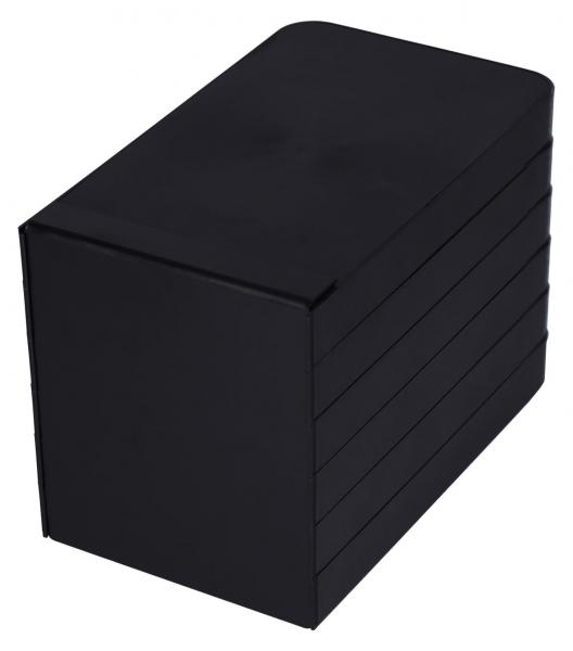Das Bild zeigt eine rechteckige, schwarze Box. Sie hat eine matte Oberfläche und besteht aus mehreren übereinander gestapelten, flachen Elementen. Die Ecken sind abgerundet.