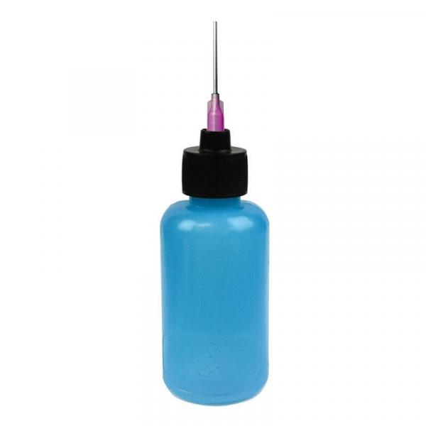The image shows a transparent, light blue bottle with a black screw cap. At the top, a thin, silver metal pin with a purple tip protrudes.