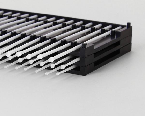 The image displays a black bracket with numerous vertically oriented, thin, white rods that are evenly spaced side by side. The rods are long and slender.