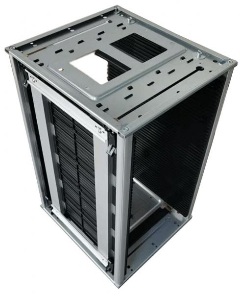 The image shows a computer case made of silver-colored metal. It has an open structure with vertical cooling slots and a compartment that provides space for components.