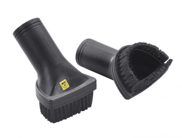 The image shows two black brush attachments. Both have a sturdy handle. One has soft bristles, the other is wide and has a rounded shape with rubber edges.