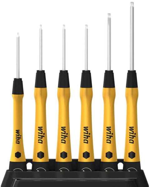 The image displays a set of six screwdrivers in various sizes. The handles are black with yellow elements and the logo "wiha" is visible on the handles. They are standing upright in a black holder.