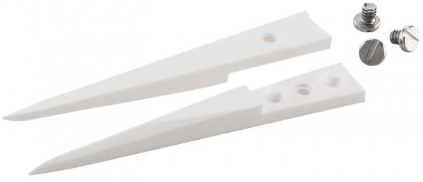 The image shows two elongated, pointed objects made of white material, shaped like wedges. Next to them are two screws, one with a Phillips head and one with a crowned head.