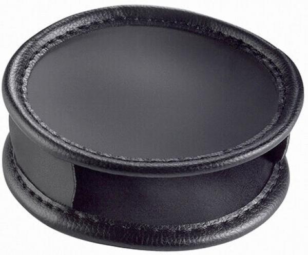 The image shows a round, flat object in black plastic and leather. It has slightly raised edges and a smooth surface, conveying a modern, elegant impression.