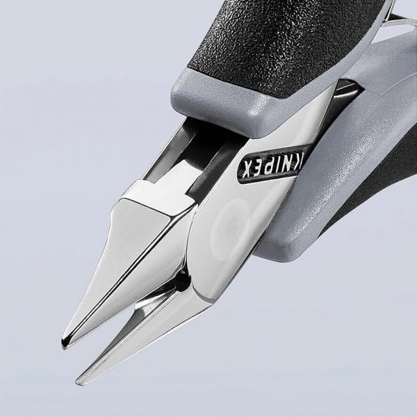 The image shows a pair of pliers with pointed, sharp grippers. The handle is black with gray details. The pliers have a shiny, metallic surface and a precise design.