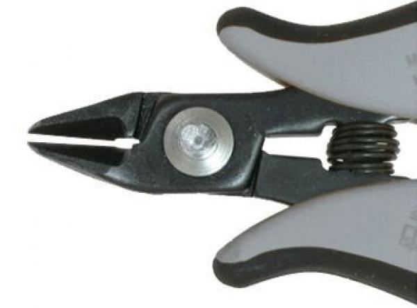 The image shows a pair of pliers with gray and black handles. The long side features a narrow, pointed edge suitable for gripping and cutting. A round, silver button is visible.