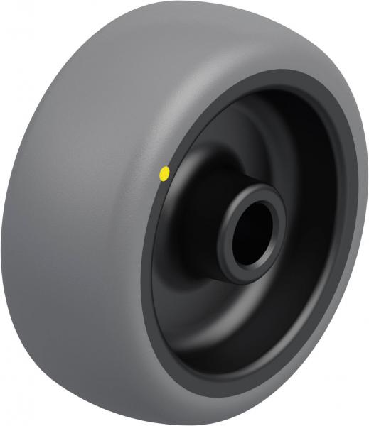 The image shows a gray wheel with a black interior. It has a smooth surface and a hole in the center. Additionally, there is a small yellow dot on the outer surface.