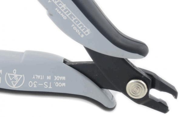 The image shows a gray pair of pliers with a black tip. The pliers have an ergonomic handle and a small screw on the side. They appear sturdy and precise.