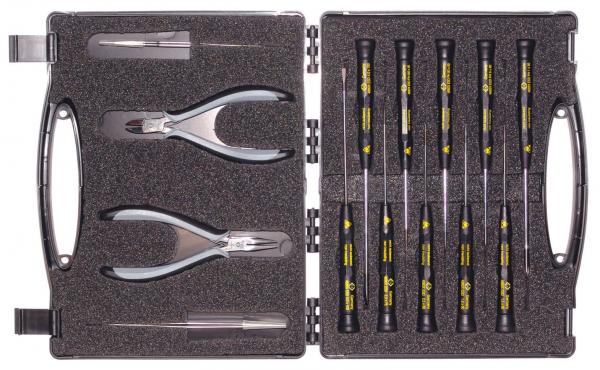 The image shows a toolbox that is open. Inside, there are two pliers and several screwdrivers with black handles and yellow labels. The case has a padded interior.