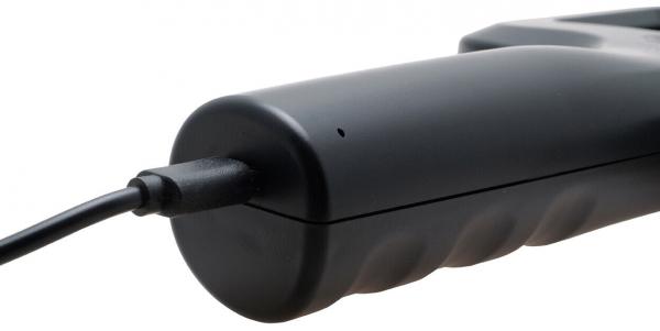 The image shows a black, ergonomically shaped hand control with a cable. The surface is smooth with textured spots for a better grip. A small dot is visible, possibly an LED.