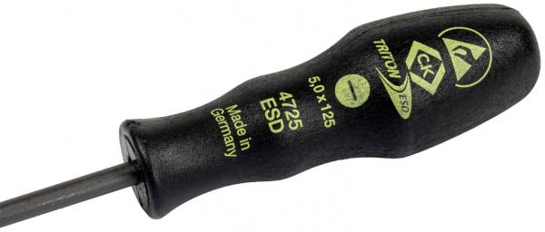 The image shows a black screwdriver with an ergonomic handle. Yellow lettering and a symbol are visible on the handle. The blade is narrow and straight.