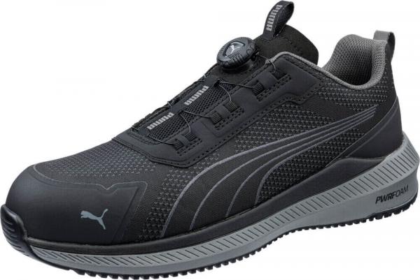 The shoe is a sporty sneaker in black with gray accents. It has a breathable upper and a comfortable sole. A quick lacing system makes it easy to put on.
