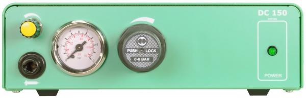 The image shows a green device with a round pressure gauge, a black button labeled "PUSH LOCK," and a green on/off light on the right side.