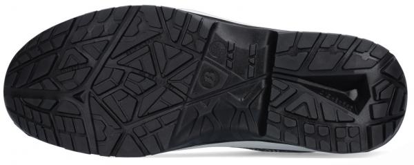 The image shows the sole of a sports shoe. It is flat and has a deep tread with various geometric patterns that provide good traction and grip. The color is black.