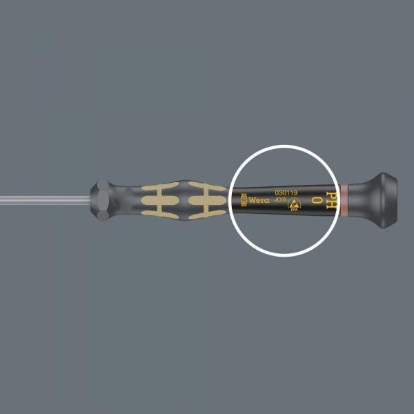 The image shows a screwdriver with a black, rubberized handle and gold-colored accents. It has a long, thin blade. Markings and the size '0' can be seen on the handle.