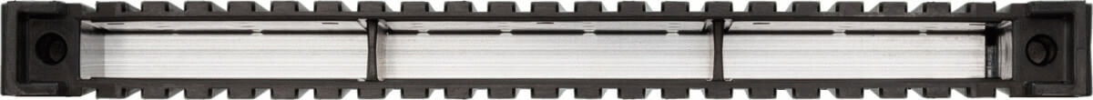 The image shows an elongated, rectangular structure in black with clear, transparent elements in the middle. The edges are serrated, and there is a round cutout at each end.