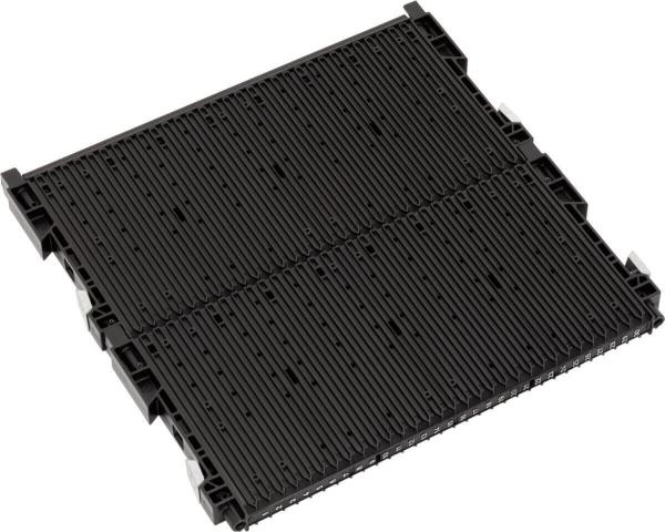 The image depicts a black palette with a textured surface and several round protrusions. It has small indentations on the sides for gripping.
