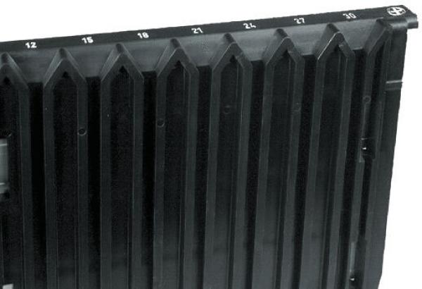 The image displays a black plastic container with rectangular, raised edges arranged vertically. At the top, there are numbered markings from 12 to 30.
