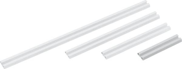 The image shows several white, elongated plastic profiles of varying lengths. They are smooth and narrow, with a rectangular cross-sectional shape.