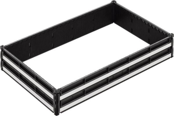 The image shows a rectangular, open container with black walls and white stripes on the short sides. The walls have a textured surface with upright, narrow indentations.