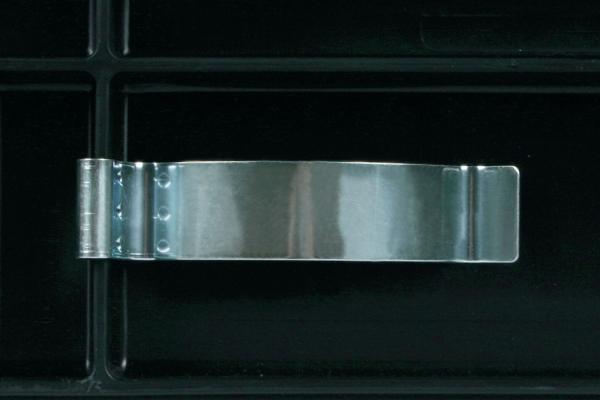 The image shows a silver, flat metal clip on a black background. The clip has a smooth surface and is centered in a rectangular area.