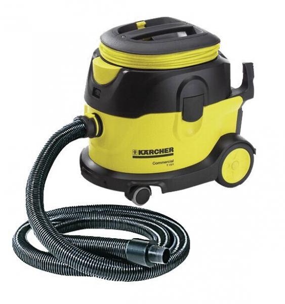 The image displays a sturdy, yellow and black vacuum cleaner with a large container on wheels. A flexible hose is attached to the side and has a smooth surface.