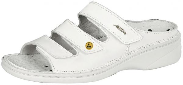The shoe is a white, open sandal with a flat heel. It has three adjustable Velcro straps on the top and a padded insole for comfort.