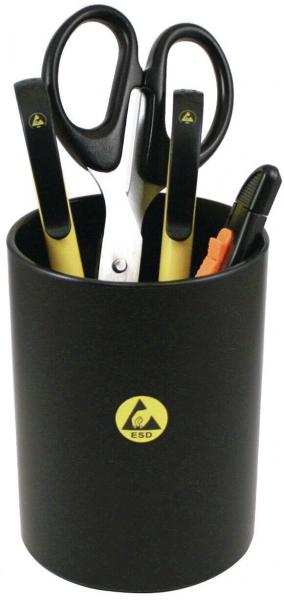 A black pen holder is on a table. It contains yellow and black scissors, a yellow marker, and other writing utensils. The container has a yellow logo.