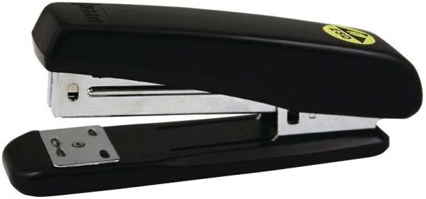 The image shows a black stapler with an ergonomic design. The upper half has a slightly curved shape, while the bottom is flat. At the front, an insertion slot and a metal clip are visible.
