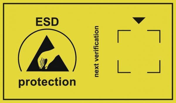 The image shows a yellow sign with a symbol for ESD protection (a hand touching an arrow). Next to it is "next inspection" with an arrow pointing downward.