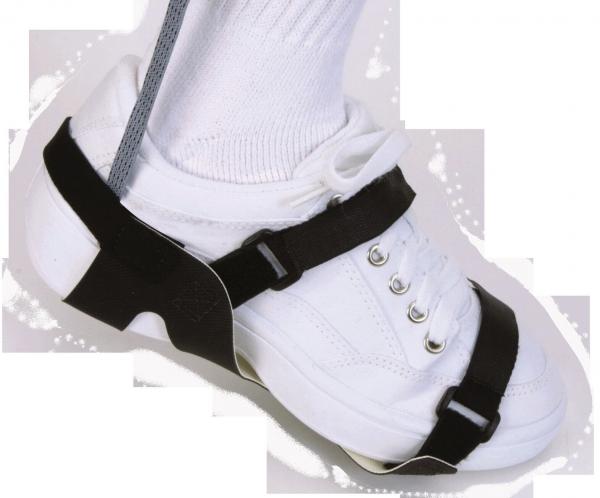 The image shows a white sports shoe that is secured with a black holder or strap. The shoe is positioned on a foot, and a gray sock is visible.