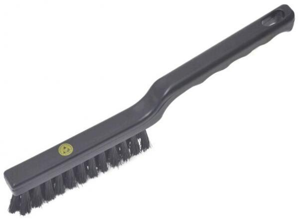 The image shows a black wire brush. It has a long, narrow handle and a flat brush surface with sturdy wire bristles that are used for cleaning.