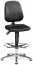 Preview: The image shows an adjustable office chair with a black, padded seat and a backrest. The chair has a chrome base with a round footrest and five casters.