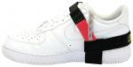 Preview: Das Bild zeigt einen weißen Sneaker der Marke Nike. Am Schuh ist ein schwarzes Band mit einer roten und einer gelben Markierung befestigt, das teilweise um den Schuh gewickelt ist.