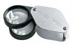 Preview: In the picture, there is a double magnifying glass that has two lenses: one for 4x and one for 6x magnification. The frame is black and silver. The lenses are clear and round.