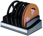 Preview: The image shows a black storage rack with several large, round spools. Some spools are brown and have a pink marking. The rack has a white label.