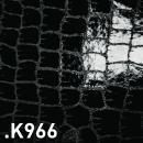 Preview: The image displays a black, shiny surface with a pattern of rectangular scales reminiscent of crocodile leather. The texture is irregular and slightly raised.