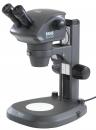 Preview: The image shows a microscope with two objectives and a stable base. It has a gray body and various controls on the side to adjust the settings.