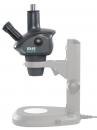 Preview: The image shows a microscope. It has a black body with two eyepieces and is mounted on a stable base. The structure is modern and functional, with controls for adjustment.