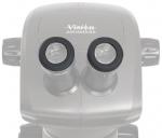 Preview: The image shows a microscope with two round eyepieces. The surface is smooth and oval. At the top, it reads 
