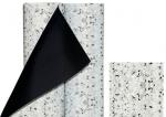 Preview: The image displays a roll of decorative material. The top layer is light with black and gray speckles, while the backside is black. Next to it lies a piece of the same material.