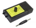 Preview: The image displays a black device with yellow lettering. It features a round dial in the center and two connectors. Next to the device, there is a small, black pen with two metallic tips.